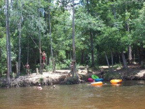 Kids are excited about the swing they found during their tubing trip Saturday on Coldwater Creek in North Santa Rosa County.