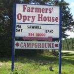 Chumuckla Highway sign advertising Farmer's Opry and Campsite.