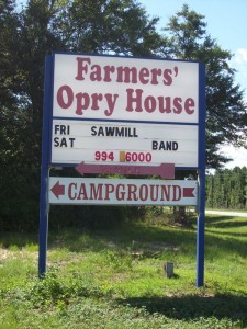 Chumuckla Highway sign advertising Farmer's Opry and Campsite.