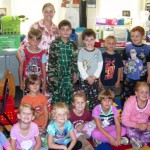 1st graders from Miss Simmons's class comfy and enjoying Pajama Day